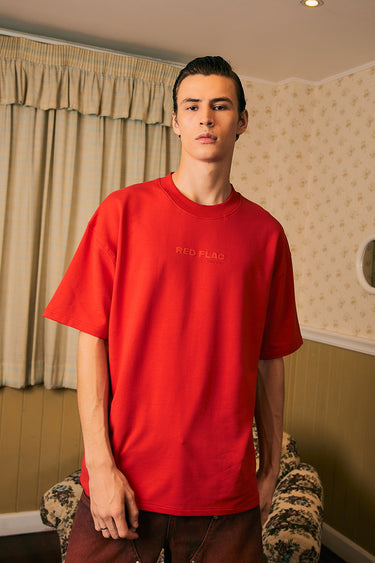 Bonkers Corner oversized red flag T-shirt, certified, with bold red flag graphic and relaxed fit, casual streetwear style.