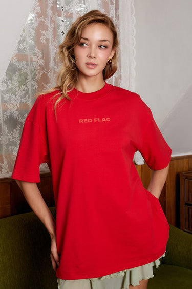 Bonkers Corner oversized red flag T-shirt featuring bold graphic print and relaxed fit, casual streetwear style.