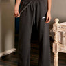 Bonkers Corner charcoal wide-leg pants, XS size, made from soft fabric, with a relaxed fit and high waist styling.