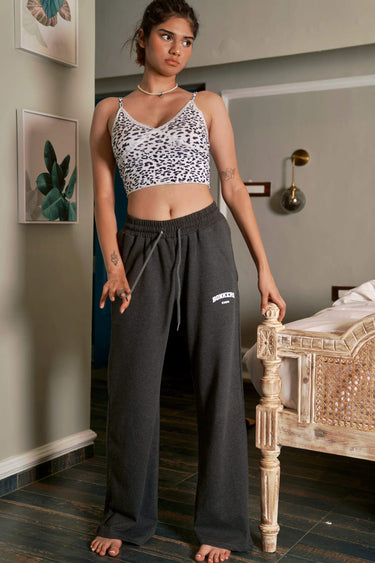 Bonkers Corner charcoal wide-leg pants made of soft fabric, featuring a relaxed fit and high waist, displayed on a model.