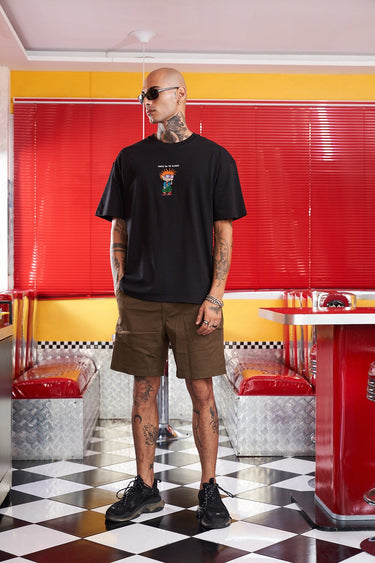 Bonkers Corner Chuckie embroidery oversized T-shirt featuring a colorful cartoon character design on soft fabric.