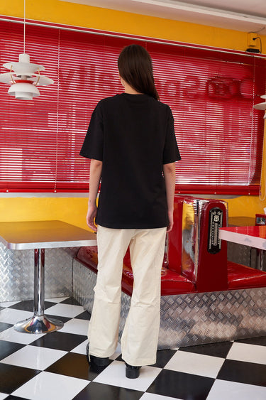 Bonkers Corner Chuckie embroidery oversized T-shirt featuring a colorful cartoon design on soft fabric.