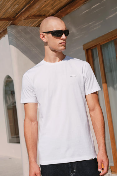Bonkers Corner classic white 100% Supima cotton relaxed fit T-shirt displayed flat with neckline and short sleeves visible.