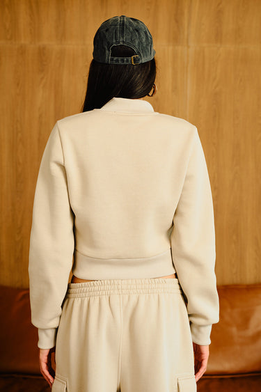Bonkers Corner cloudy crop zipper jacket in light gray with a front zipper and cropped fit, shown on a model.