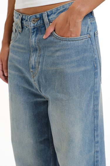 Bonkers Corner crisp blue wide-leg jeans displayed on a hanger, showcasing relaxed fit and stylish denim design.
