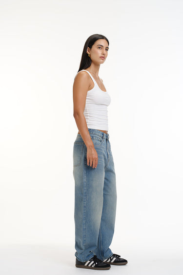 Bonkers Corner Crisp Blue Wide-Leg Jeans displayed on a model, showcasing relaxed fit and stylish denim design.