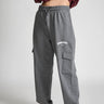 Dark grey melange cargo pants by Bonkers Corner, showing relaxed fit with multiple pockets and casual style.