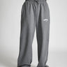 Dark grey melange wide-leg pants by Bonkers Corner, shown in a close-up image highlighting the fabric texture and fit.