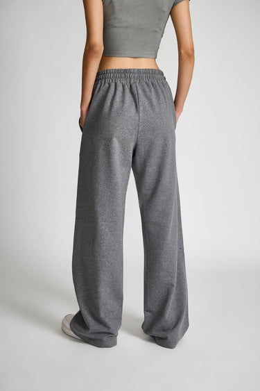 Dark grey melange wide-leg pants by Bonkers Corner, shown on a model with relaxed fit and stylish design.