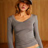 Dark grey modal long sleeve top by Bonkers Corner, shown on a model with a relaxed fit and round neckline.