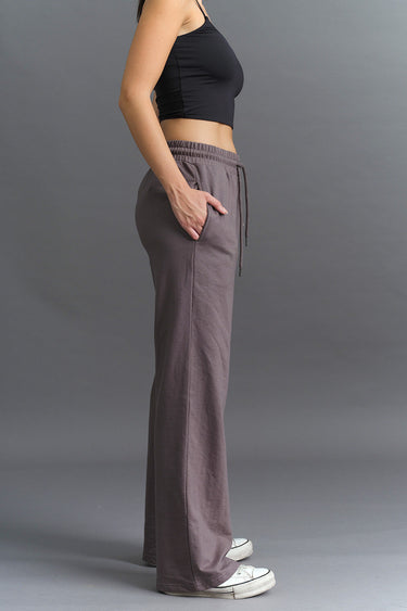 Dark Shadow wide-leg sweatpants by Bonkers Corner, featuring a relaxed fit and comfortable fabric, shown on a model.