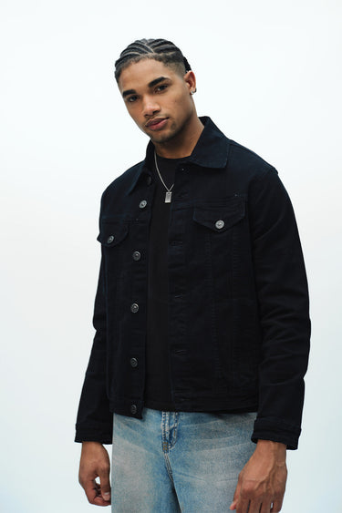 Bonkers Corner denim jacket in light wash with classic collar and button-front design, displayed on a hanger.