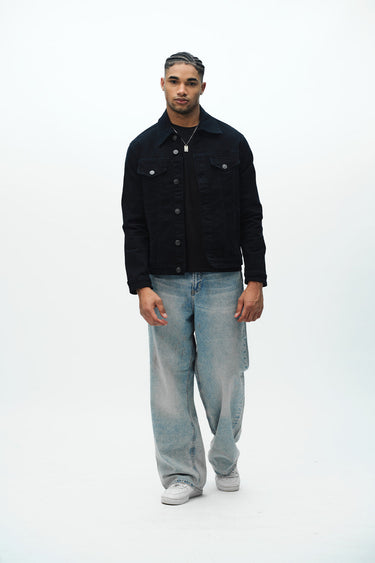 Bonkers Corner denim jacket in light wash with classic collar and button-front design, displayed on a hanger.