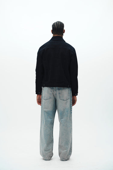 Bonkers Corner denim jacket in light wash with classic collar and button front, displayed on a hanger.