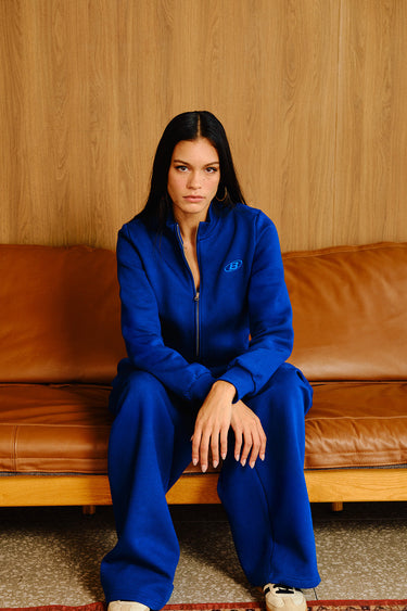Electric blue crop zipper jacket by Bonkers Corner, featuring a fitted design, front zipper, and stylish collar detail.