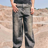 Faded grey baggy fit jeans by Bonkers Corner displayed on a model, showcasing relaxed style and casual streetwear look.