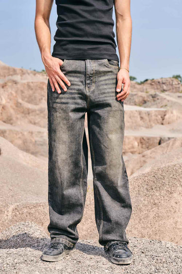 Faded grey baggy fit jeans by Bonkers Corner displayed on a model, showcasing relaxed style and casual streetwear look.
