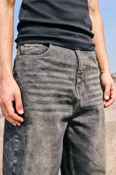 Bonkers Corner faded grey baggy fit jeans displayed on a model, showcasing relaxed fit and casual style.