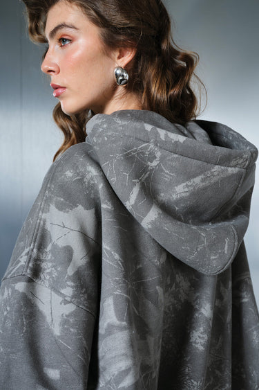 Faded grey Bonkers Corner hoodie with a relaxed fit, showing the soft fabric and casual style on a plain background.