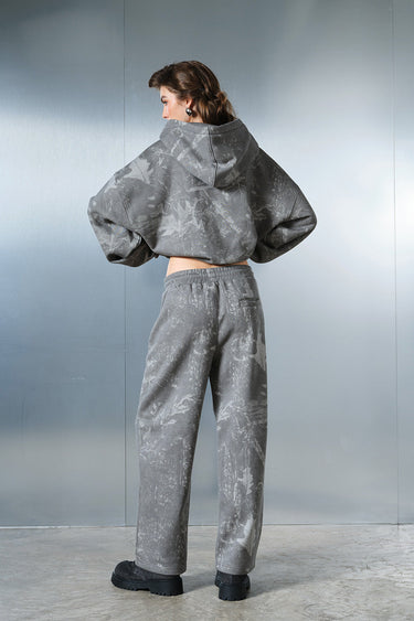 Faded grey Bonkers Corner hoodie with a relaxed fit, featuring a soft fabric and casual style, shown on a model.