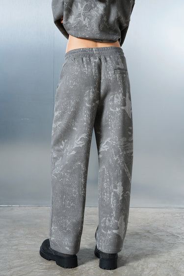 Faded grey Bonkers Corner joggers displayed on a model, featuring a relaxed fit and casual style.