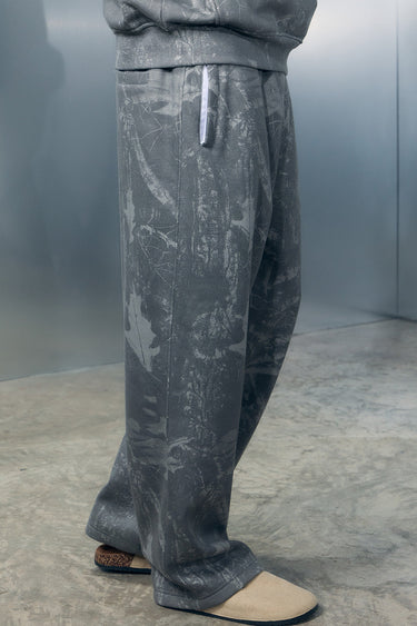 Faded grey Bonkers Corner joggers with elastic waistband and cuffs, casual fit, made from soft comfortable fabric.