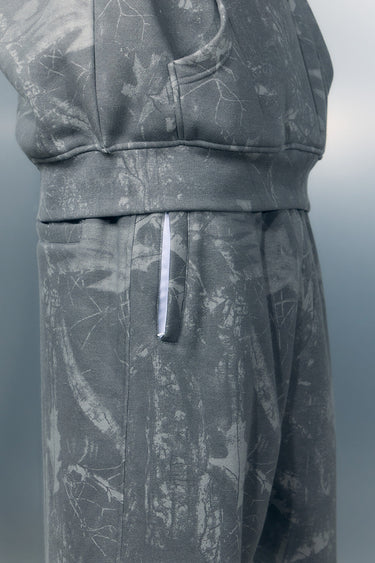 Faded grey Bonkers Corner joggers on a person, showing relaxed fit and soft fabric, casual loungewear for everyday comfort.