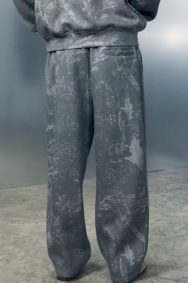 Bonkers Corner faded grey joggers displayed on a model, showcasing relaxed fit and comfortable casual style.