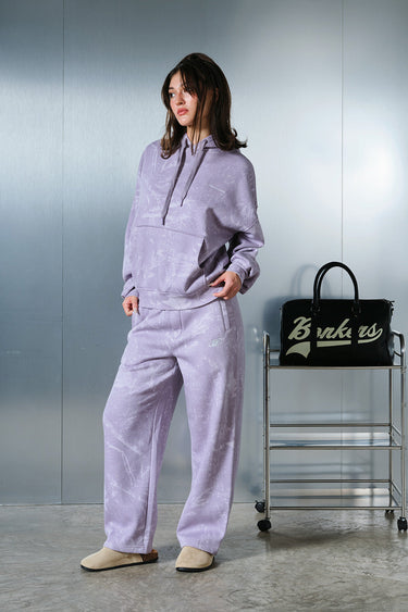 Faded lavender hoodie from Bonkers Corner with a relaxed fit, soft fabric, and casual style, shown on a model.