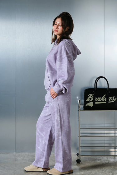 Bonkers Corner faded lavender hoodie displayed flat, showing soft fabric, hood, and front pocket details.