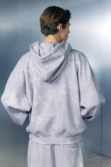 Bonkers Corner faded lavender hoodie, casual unisex sweatshirt with soft fabric and relaxed fit, displayed on a hanger.