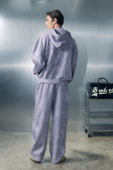 Bonkers Corner faded lavender hoodie with a relaxed fit and soft fabric, displayed on a hanger.