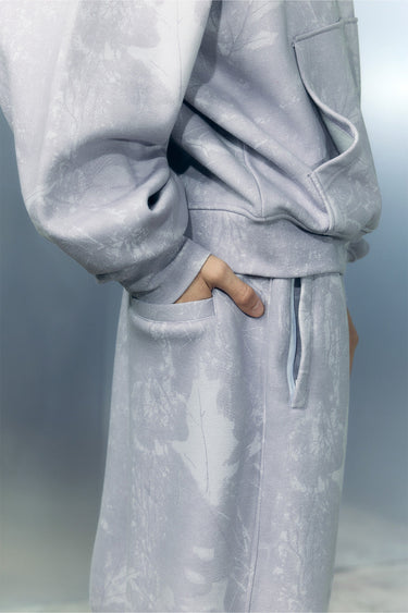 Light purple faded lavender joggers from Bonkers Corner, shown on a model, with a relaxed fit and elastic waistband.