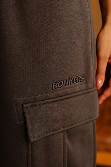 Bonkers Corner Fadeout Olive 4-pocket pants showing front view with multiple pockets and casual fit.