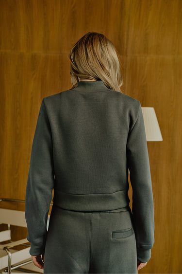 Bonkers Corner Fadeout Olive Crop Zipper Jacket shown in XS with front zipper and slim fit design.