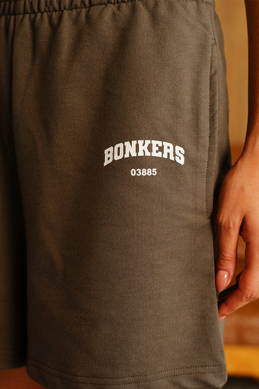 Bonkers Corner Fog Olive Lounge Shorts shown on model, featuring relaxed fit and comfortable fabric for casual wear.