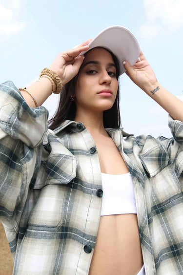 Green plaid flannel oversized shirt by Bonkers Corner, featuring a relaxed fit and classic checkered pattern.