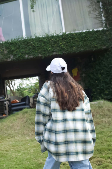 Green plaid flannel oversized shirt by Bonkers Corner, featuring a relaxed fit and classic checkered pattern.