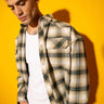 Green plaid flannel oversized shirt by Bonkers Corner, featuring a relaxed fit and classic plaid pattern, shown on a hanger.