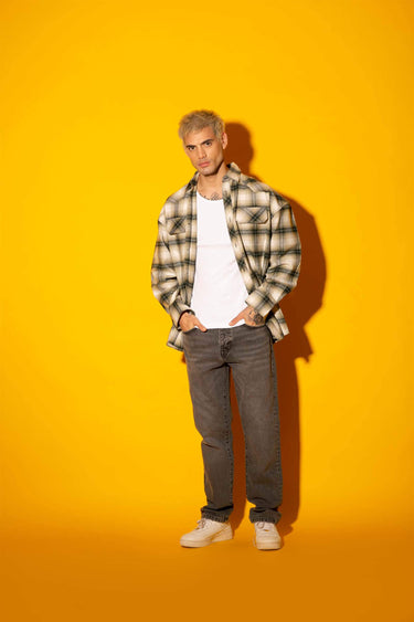Green plaid flannel oversized shirt by Bonkers Corner, showing a cozy, relaxed fit with classic plaid pattern and button front.