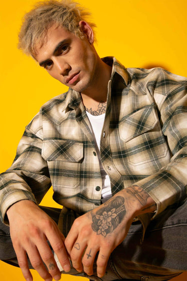 Green plaid flannel oversized shirt by Bonkers Corner, featuring a relaxed fit and classic checkered pattern.