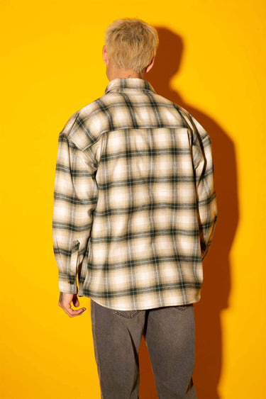 Green plaid flannel oversized shirt by Bonkers Corner, featuring a relaxed fit and classic button-up style.