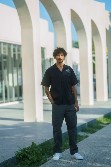 Grey cargo pants with utility pockets from Bonkers Corner, featuring a relaxed fit and functional design.