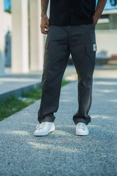 Grey cargo pants with utility pockets from Bonkers Corner, featuring a relaxed fit and functional design.