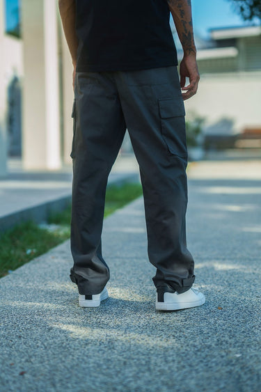 Grey cargo pants with utility pockets from Bonkers Corner, showcasing durable fabric and functional pocket detailing.