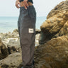 Grey cargo pants with utility pockets from Bonkers Corner, featuring a relaxed fit and functional pocket details.