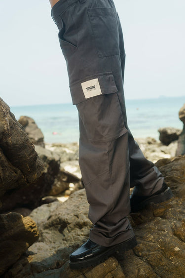 Grey cargo pants with utility pockets from Bonkers Corner, featuring a relaxed fit and functional design.