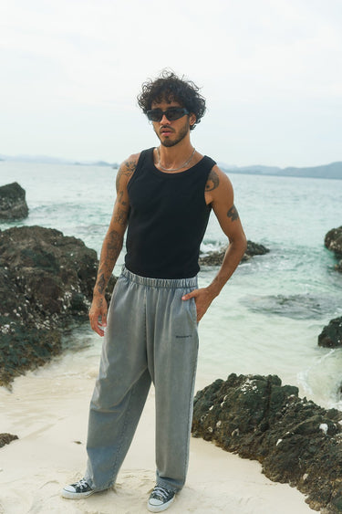 Grey faded loose fit pants by Bonkers Corner, showing relaxed fit and casual style on a neutral background.