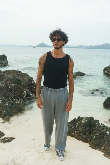 Grey faded loose-fit pants by Bonkers Corner, shown on a model with a relaxed style and casual fit.