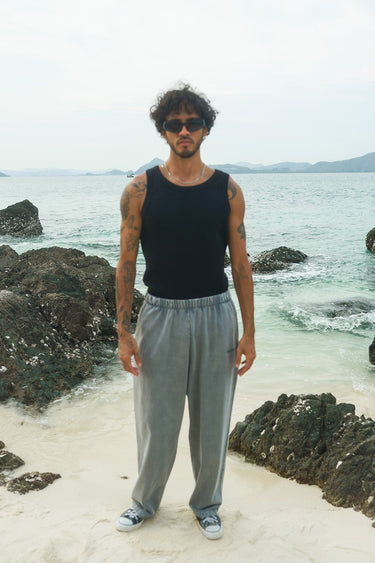 Grey faded loose fit pants by Bonkers Corner, shown on a model with a relaxed style and casual fit.